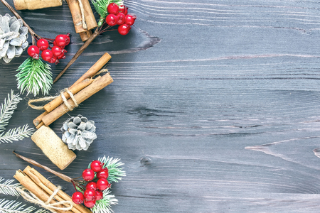 Cinnamon sticks and cork from wine on a wooden backgroundの写真素材