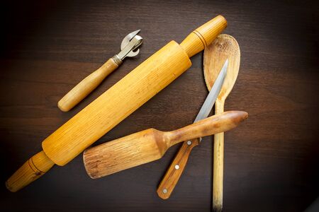 Wooden spoon and fork, knife on grunge wood backgroundの写真素材