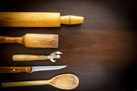 Wooden spoon and fork, knife on grunge wood backgroundの写真素材