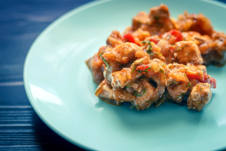 Meat stew on a blue plateの写真素材
