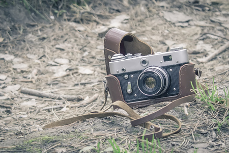 Old retro camera in forestの写真素材
