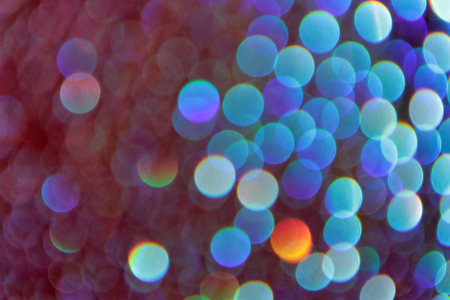 Multicolor bokeh abstract background caused by spray water.の写真素材