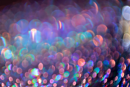 Multicolor bokeh abstract background caused by spray water.の写真素材