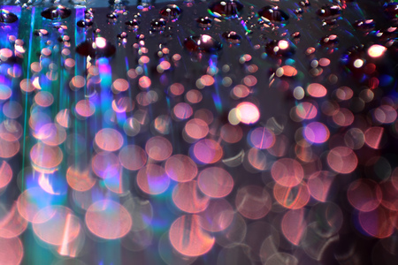 Multicolored water droplets close-up. Beautiful bokeh.の写真素材