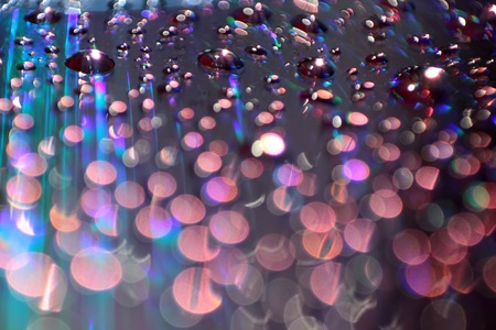 Multicolored water droplets close-up. Beautiful bokeh.の写真素材
