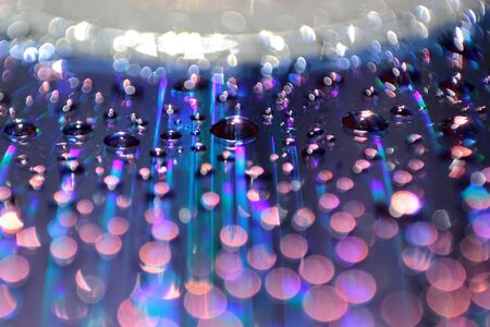 Multicolored water droplets close-up. Beautiful bokeh.の写真素材