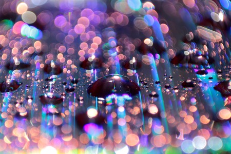 Multicolored water droplets close-up. Beautiful bokeh.の写真素材