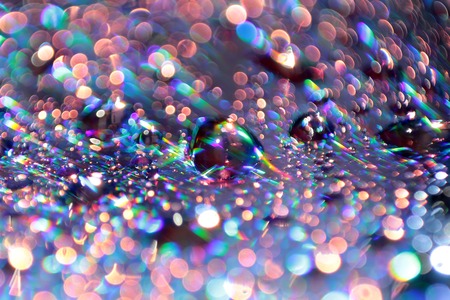 Multicolored water droplets close-up. Beautiful bokeh.