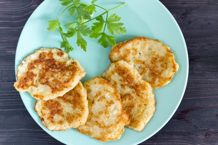 Draniki on a blue plate. Traditional Ukrainian and Russian cuisine.の写真素材