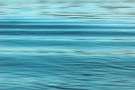 Waving blue water surfaceの写真素材