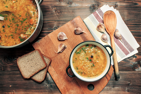 Russian traditional soup - borscht in a white plate on a wooden background. View from aboveの写真素材