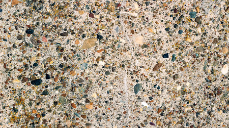 Pebble or gravel stone texture wall floor colorful background. Wall made from pebble gravel stones different shape as floor texture background.の写真素材