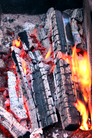 Burning charcoal on barbecue grill. Vertical viewの写真素材