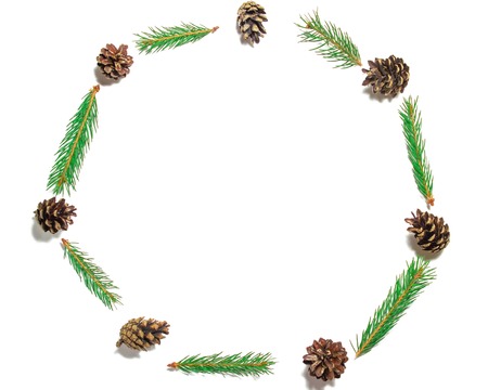 Christmas composition with frame of natural fir branches and pine cones. Top view, blank space