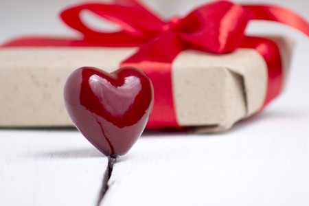 red heart with a gift on a white background. Top view. for valentines dayの写真素材