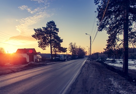 Asphalt road at sunrise and sunlight. Spring background.の写真素材