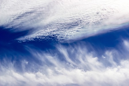 Fantastic white clouds against blue summer sky