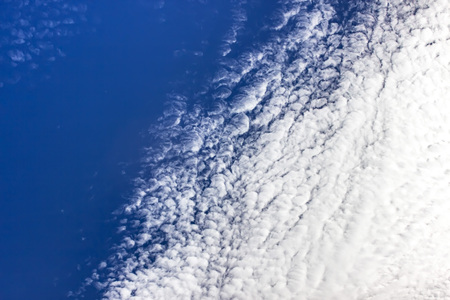 Fantastic white clouds against blue summer sky