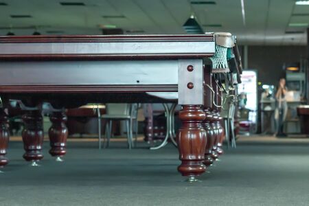 Interior of a club having billiard tables