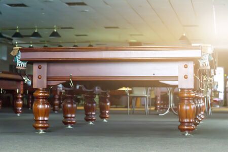 Interior of a club having billiard tables