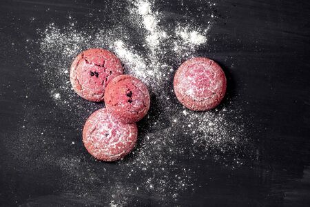 Chocolate red cookies on dark wooden table. Top viewの写真素材