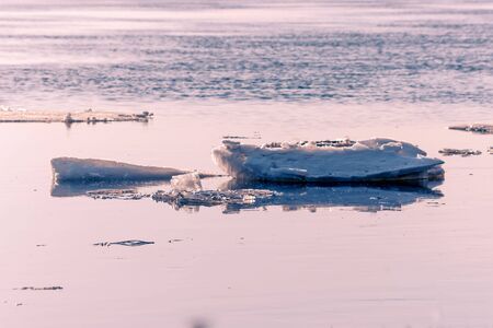 Big chunk of ice in the river Volga on a spring dayの写真素材