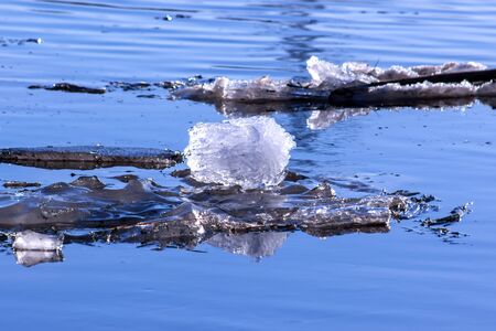 Big chunk of ice in the river Volga on a spring day