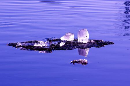Big chunk of ice in the river Volga on a spring day
