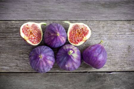 A fresh figs on old wooden background.