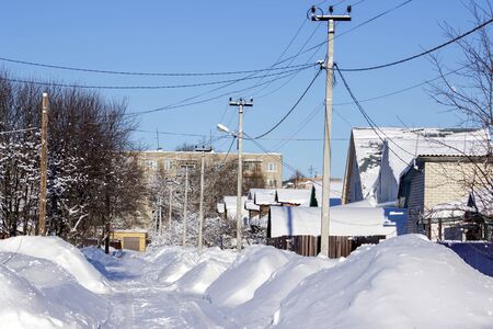 Russian winter village, snow, sun, the central part of Russiaの写真素材