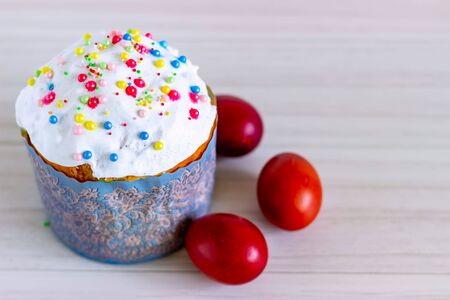 Homemade Easter cake and painted eggs on the table
