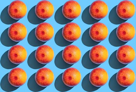 background of orange pattern, one grapefruit top view on blue background. From top view.の写真素材