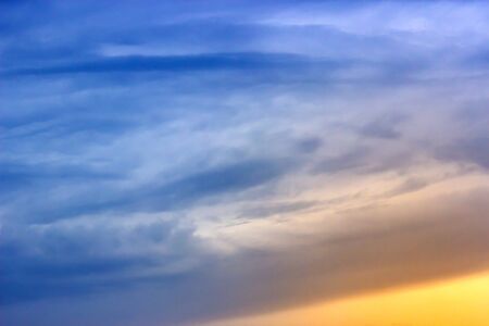 Dramatic sky with clouds on sunset evening. Natural abstract background.の写真素材