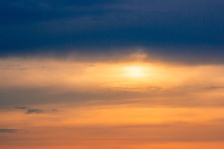 Dramatic sky with clouds on sunset evening. Natural abstract background.の写真素材