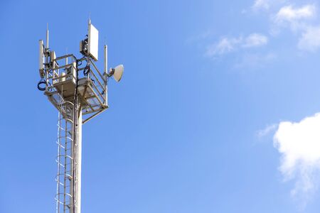 Telecommunications equipment, cell tower, directional mobile phone antenna dishes. Wireless communication.の写真素材