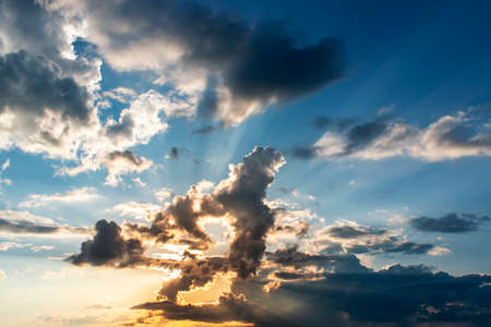 Dramatic sky with clouds on sunset. Nature composition. Summer backgroundの写真素材