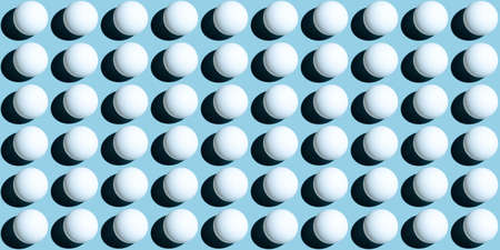 A pattern of white balls as spheres isolated on uniform blue background. Banner size.