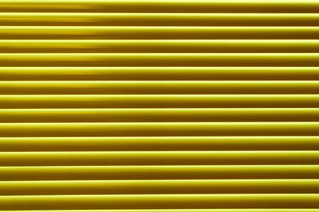 Yellow metal blinds. Abstract creative background.の写真素材