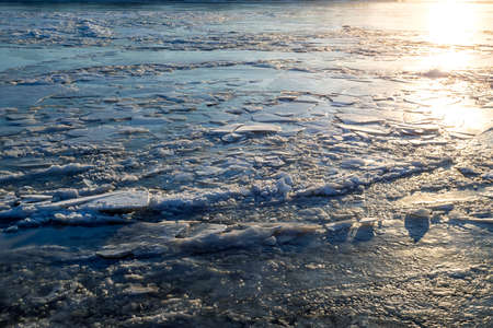 Ice texture on the river of the sunset sun. Selective focusの写真素材