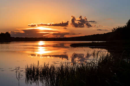 Golden sunset on the lake in Russiaの写真素材