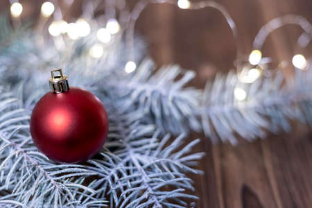 Winter, Christmas decor with red ball on wooden backgroundの写真素材