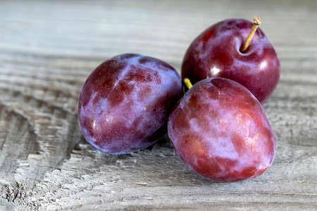 Ripe washed plums close up.の写真素材