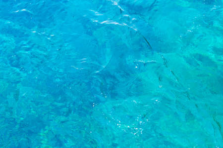 Blue turquoise sea with waves and foamの写真素材