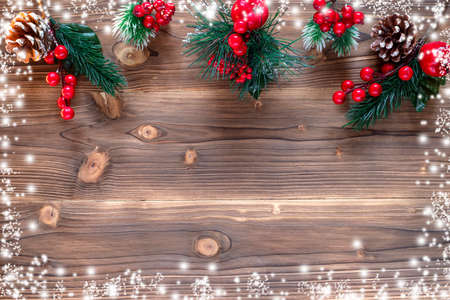 Christmas decoration with pine branches, cones and red berries. Top view. Flat layの写真素材