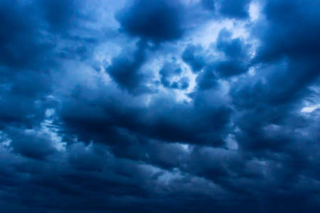 The big powerful storm clouds before a thunder-storm. Storm clouds at sunsetの写真素材