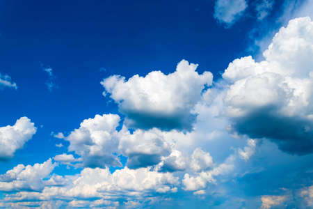 Blue sky with white clouds in sunny summer dayの写真素材
