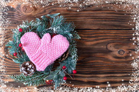 Christmas brown background with fir tree and decoration on dark wooden board. Christmas wallpaper. Christmas, New Year's composition. Flat lay, top view. Space for textの写真素材