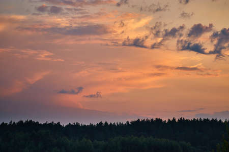 Real majestic sunrise sundown sky background with gentle colorful clouds. Gentle summer dawn with beautiful sky.の写真素材