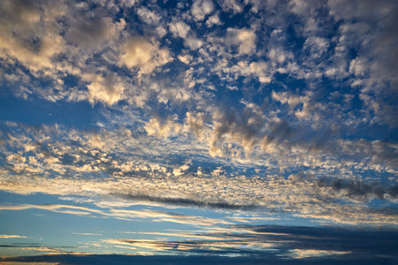 Beautiful cloudy shining sky in the sunset.の写真素材