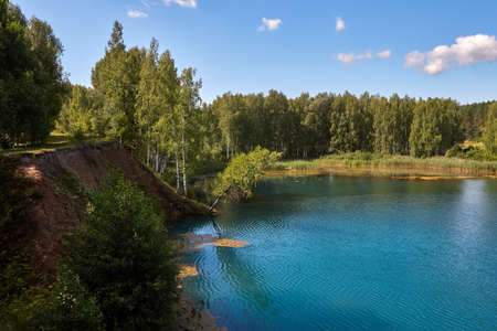 Beautiful lake with blue water in the forest in Russia.の写真素材